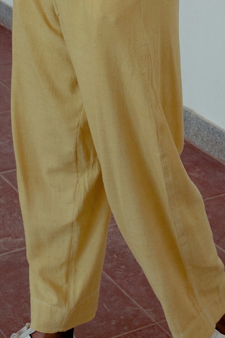 Marigold Yellow Hand-Dyed Pleated Trousers by Naushad Ali Men at Pernia's Pop Up Shop