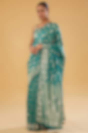 Blue Silk Blend Brocade Crystal Embellished Woven Saree Set by NARMADESHWARI