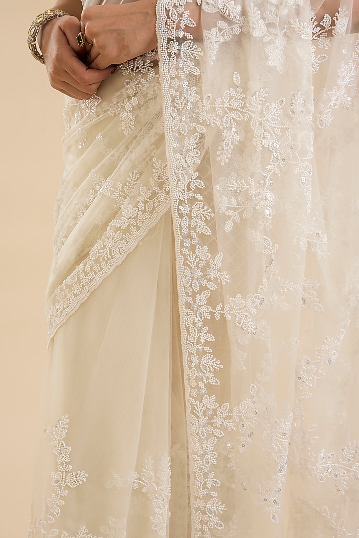 Cream Net Cutdana & Sequin Embellished Party Wear Saree Set by NARMADESHWARI at Pernia's Pop Up Shop