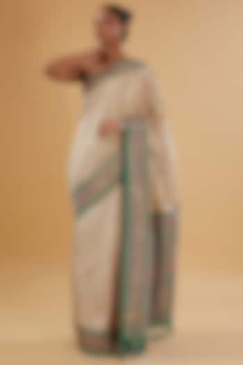 Ivory & Turquoise Silk Floral Printed & Swarovski Embroidered Woven Saree Set by NARMADESHWARI at Pernia's Pop Up Shop