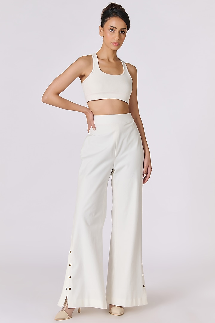 Off-White Denim Flared Trousers by S&N by Shantnu Nikhil at Pernia's Pop Up Shop