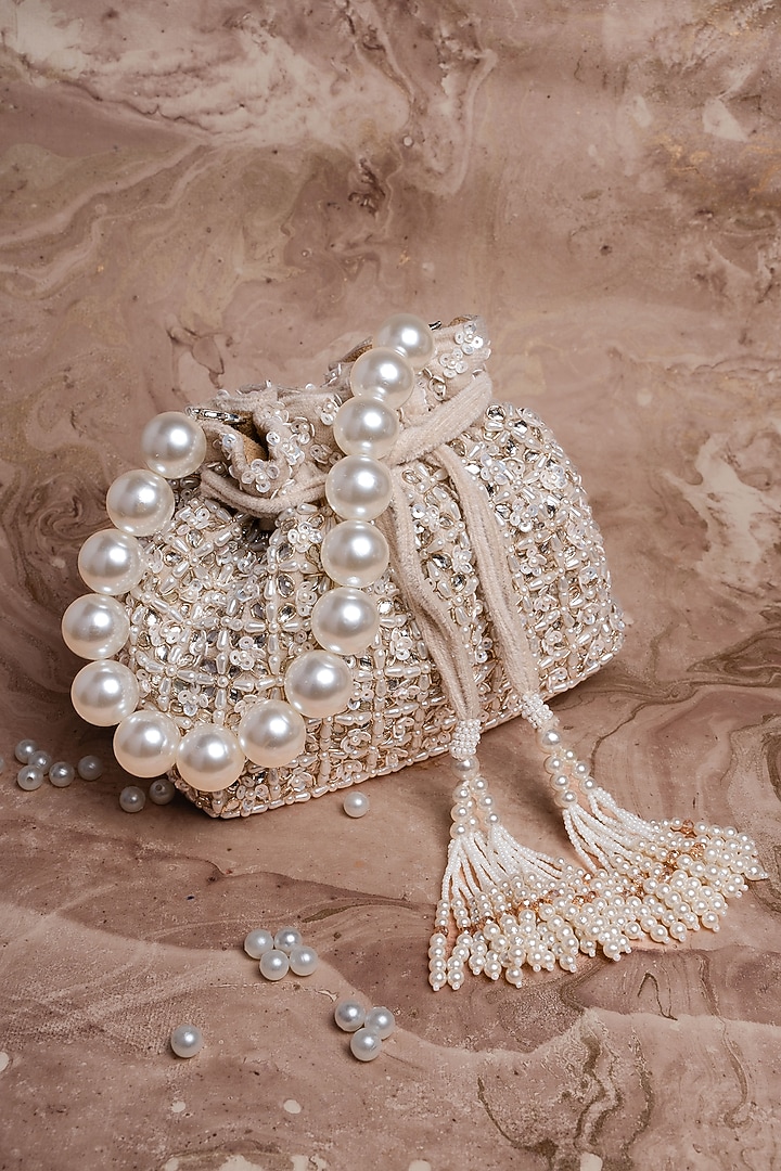 Ivory Velvet Pearl Work Potli by Nayaab by Sonia at Pernia's Pop Up Shop