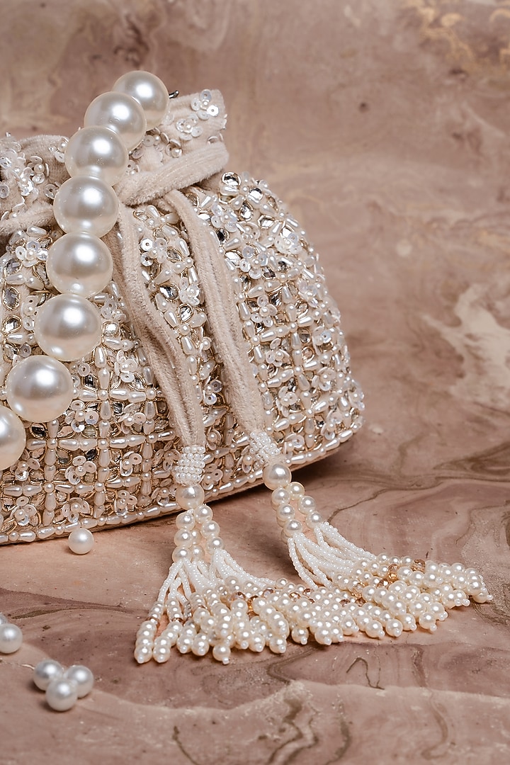 Ivory Velvet Pearl Work Potli by Nayaab by Sonia at Pernia's Pop Up Shop