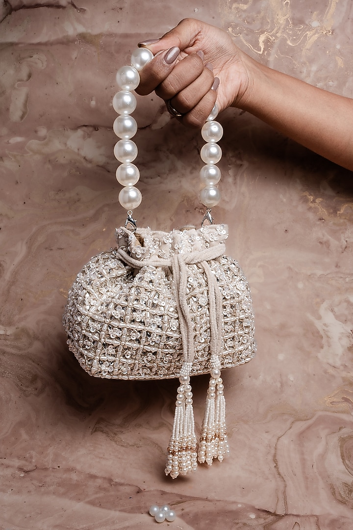 Ivory Velvet Pearl Work Potli by Nayaab by Sonia at Pernia's Pop Up Shop