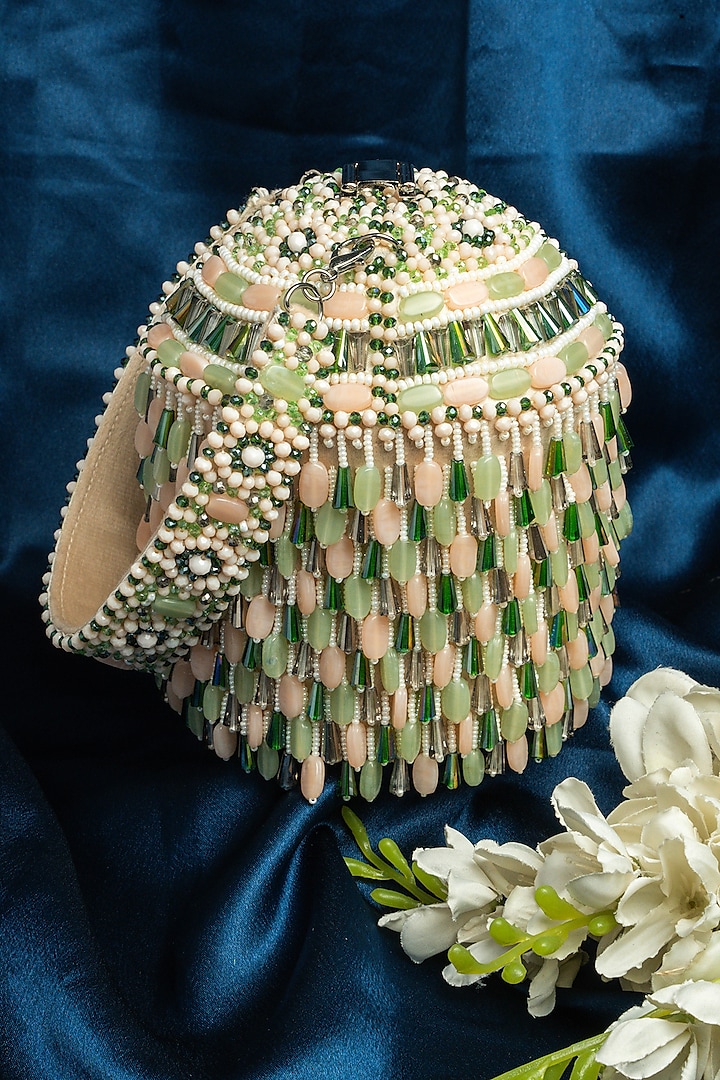 Green & Off-White Suede Bead Work Potli by Nayaab by Sonia at Pernia's Pop Up Shop