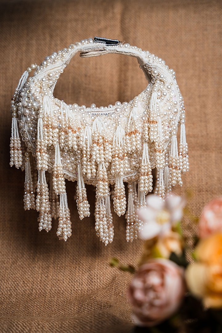 Off-White Suede Pearl & Beaded Potli by Nayaab by Sonia at Pernia's Pop Up Shop