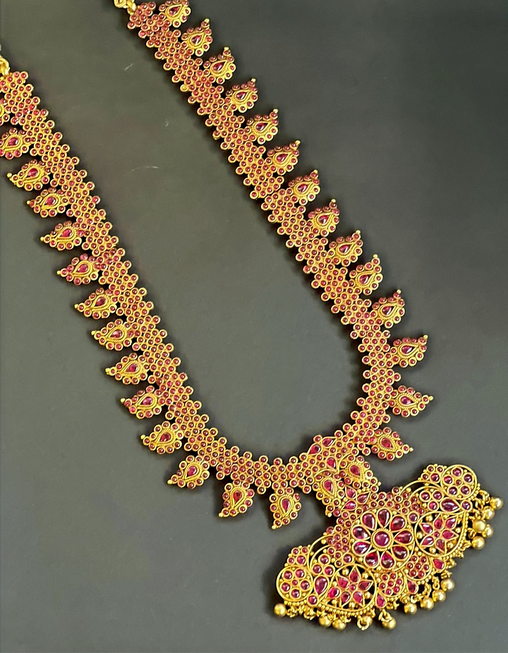 Gold Finish Stone Temple Long Necklace by Nayaab by Sonia