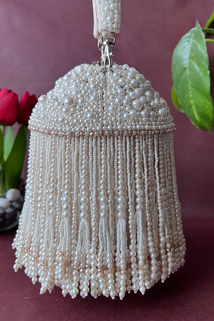 Off-White Suede Embroidered Potli by Nayaab by Sonia at Pernia's Pop Up Shop