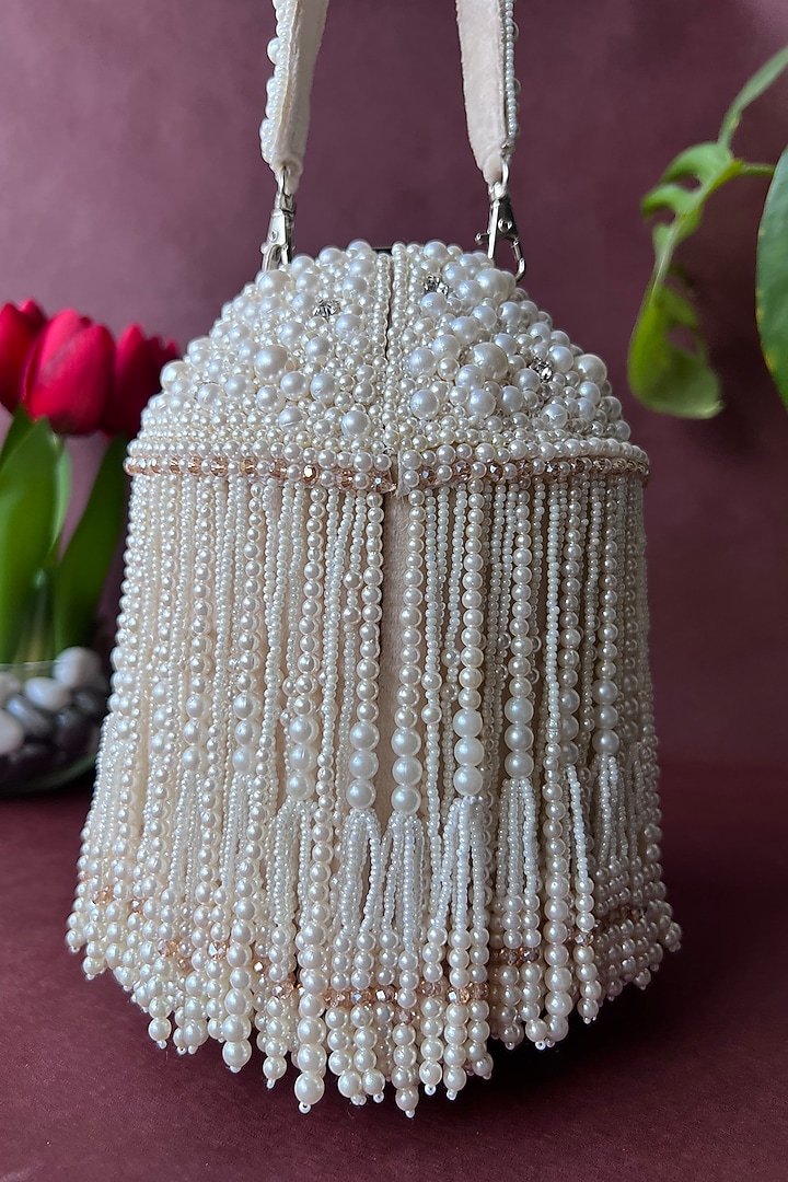 Off-White Suede Embroidered Potli by Nayaab by Sonia at Pernia's Pop Up Shop
