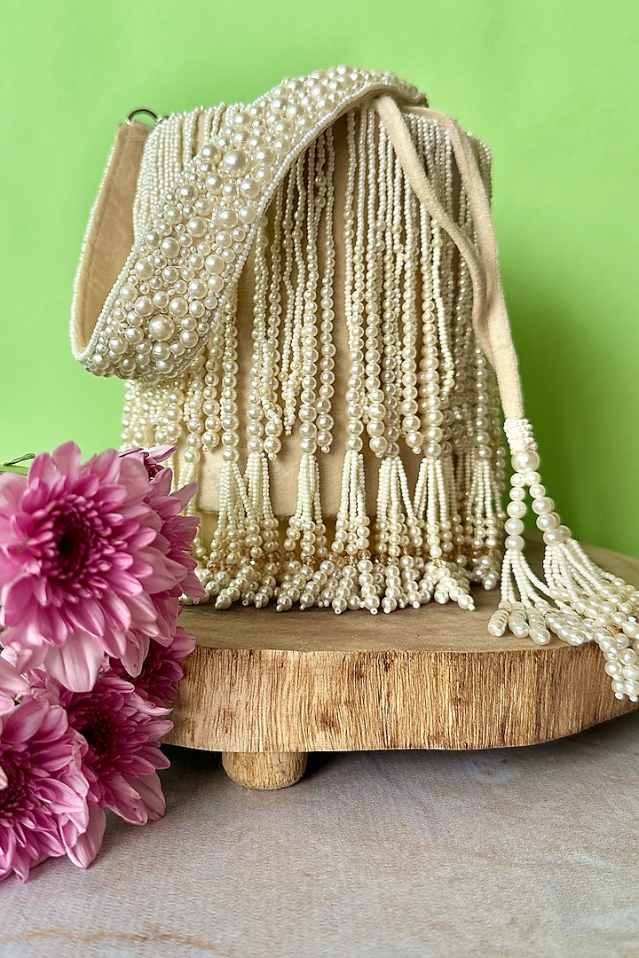 Ivory Suede Pearl Tassel Embroidered Potli by Nayaab by Sonia