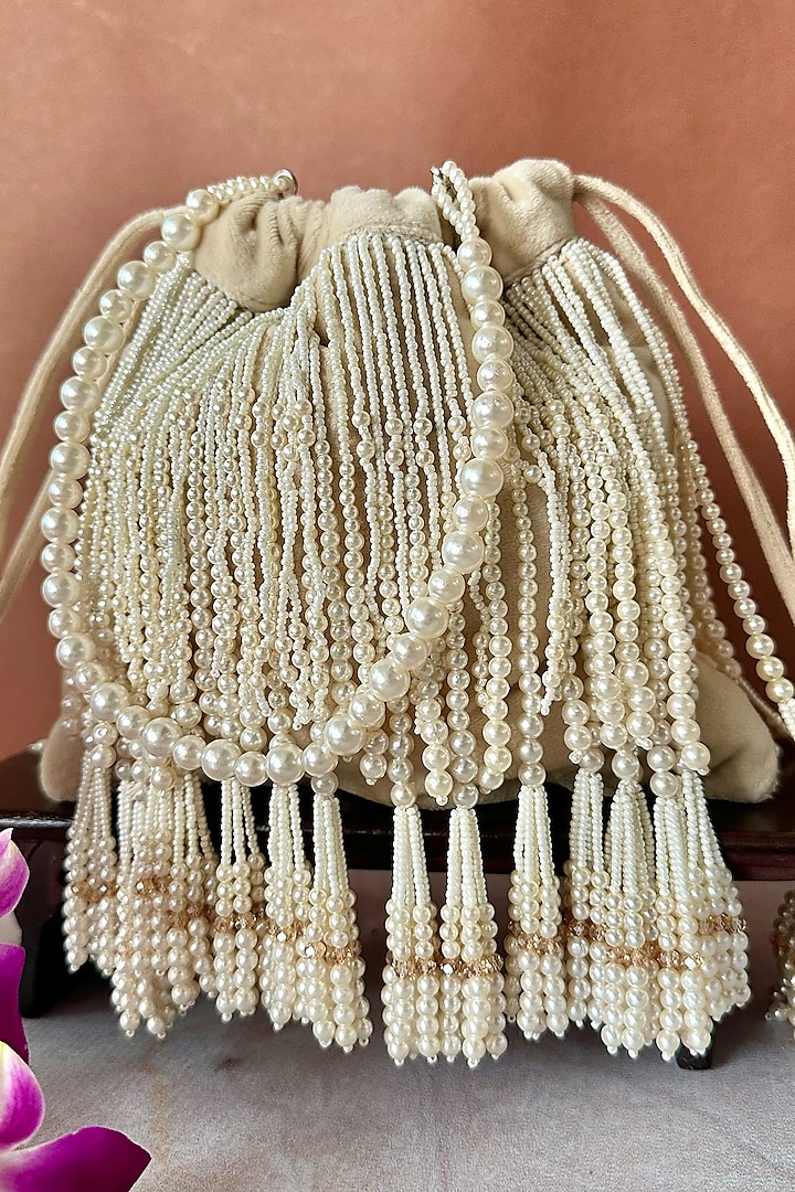 Off-White Suede Pearl Tassel Embroidered Potli by Nayaab by Sonia