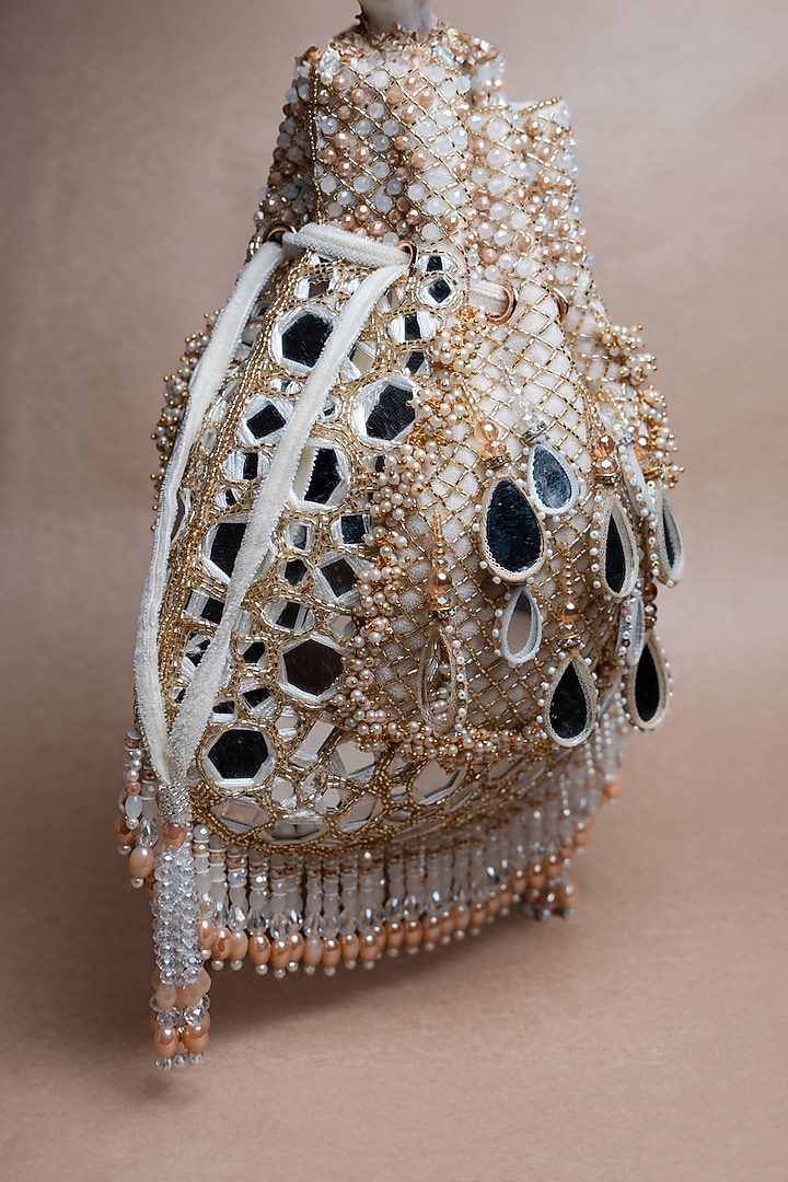 Ivory Silk Mirror Embroidered Potli Bag by Nayaab by Sonia at Pernia's Pop Up Shop