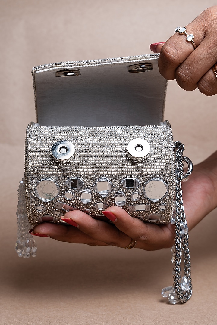 Silver Silk Mirror Embroidered Cylindrical Potli Bag by Nayaab by Sonia at Pernia's Pop Up Shop