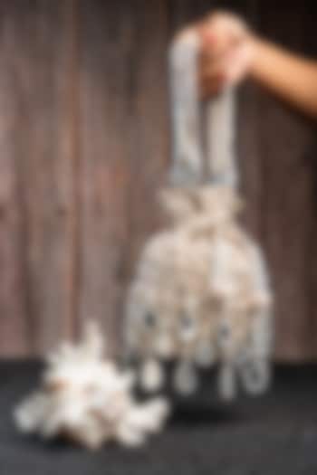 Off-White Silk Mirror Work Potli by Nayaab by Sonia at Pernia's Pop Up Shop