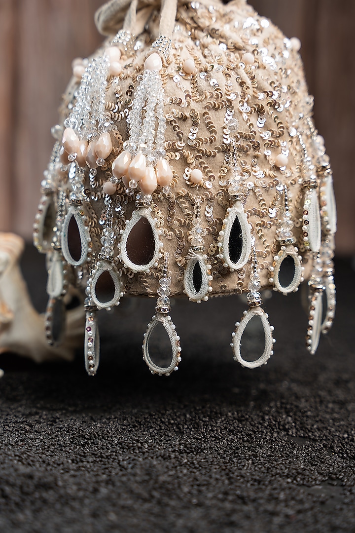 Off-White Silk Mirror Work Potli by Nayaab by Sonia at Pernia's Pop Up Shop