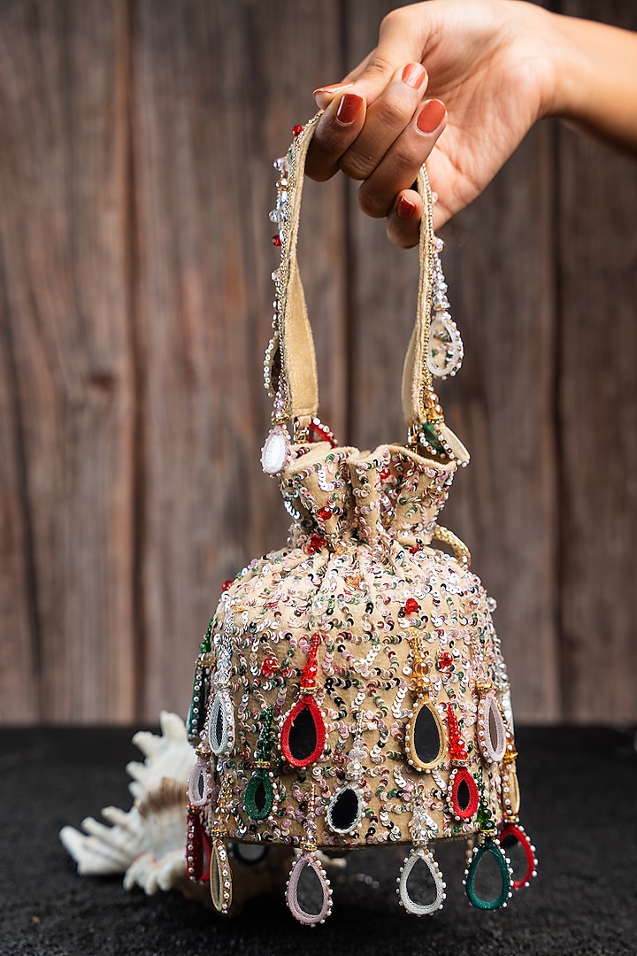 Off-White Silk Mirror Work Potli by Nayaab by Sonia at Pernia's Pop Up Shop