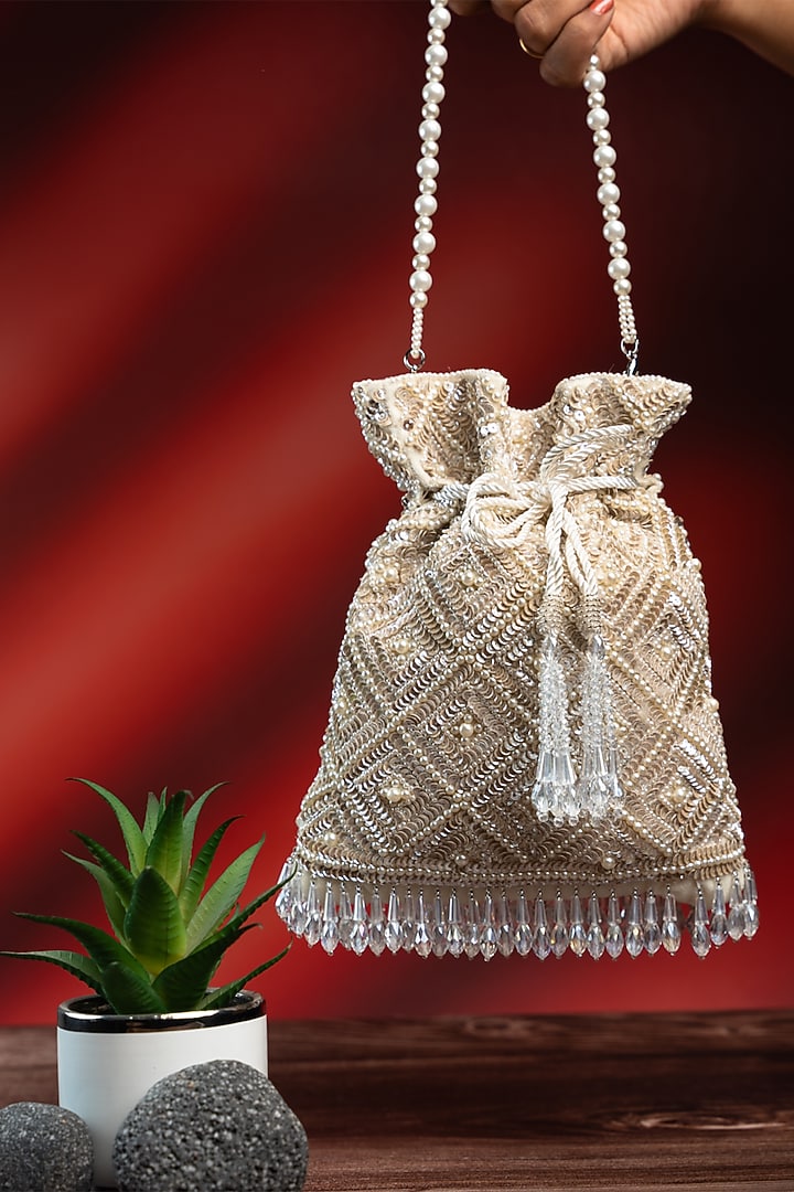 Off-White Silk Pearl Work Potli by Nayaab by Sonia at Pernia's Pop Up Shop