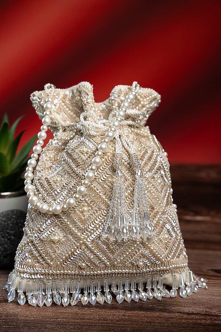 Off-White Silk Pearl Work Potli by Nayaab by Sonia at Pernia's Pop Up Shop