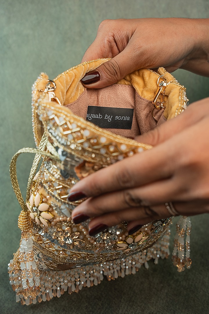 Gold Silk Floral & Sequin Embroidered Potli Bag by Nayaab by Sonia at Pernia's Pop Up Shop