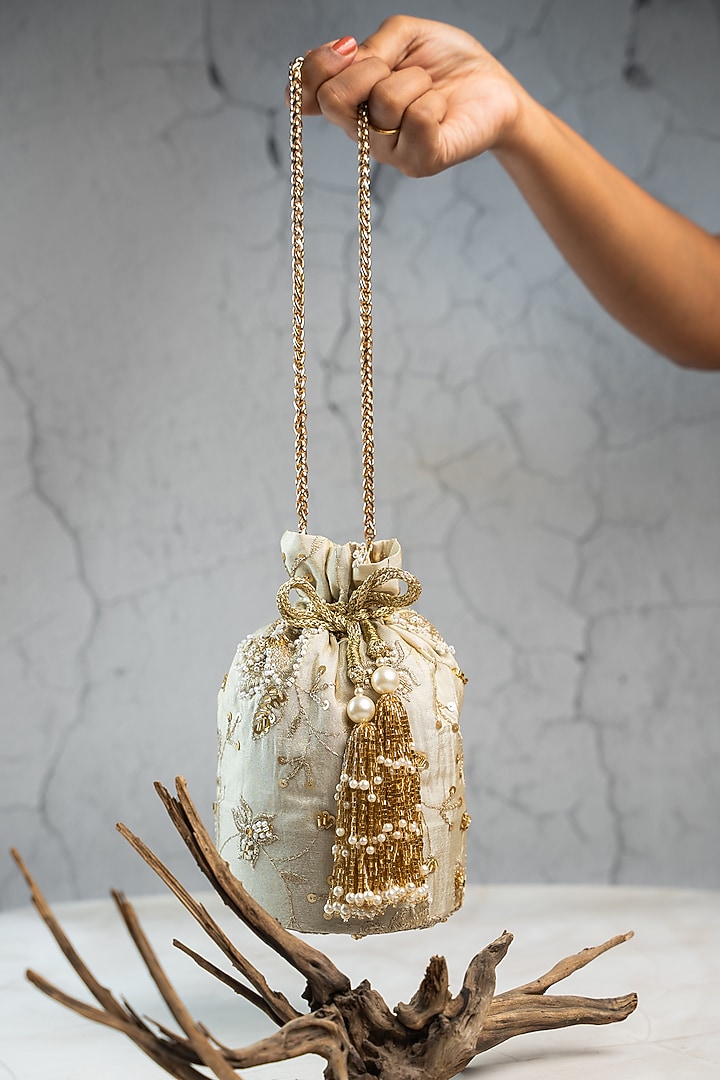 Off-White Jute Sequins & Bead Embroidered Bucket Bag by Nayaab by Sonia at Pernia's Pop Up Shop
