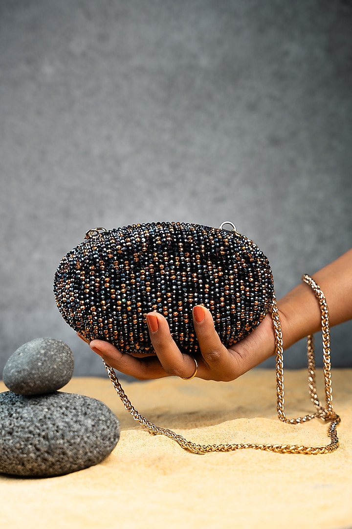 Black & Copper Silk Bead Embroidered Oval Clutch by Nayaab by Sonia at Pernia's Pop Up Shop