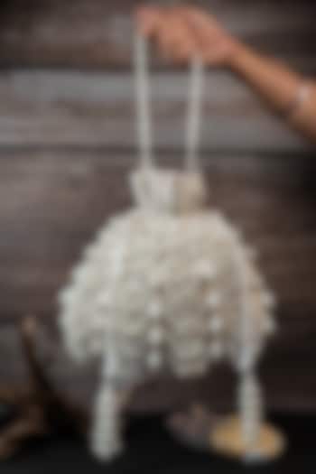 Ivory Velvet Embroidered Potli by Nayaab by Sonia at Pernia's Pop Up Shop