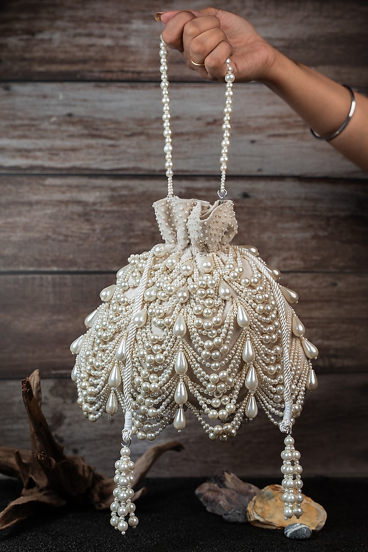 Ivory Velvet Embroidered Potli by Nayaab by Sonia at Pernia's Pop Up Shop