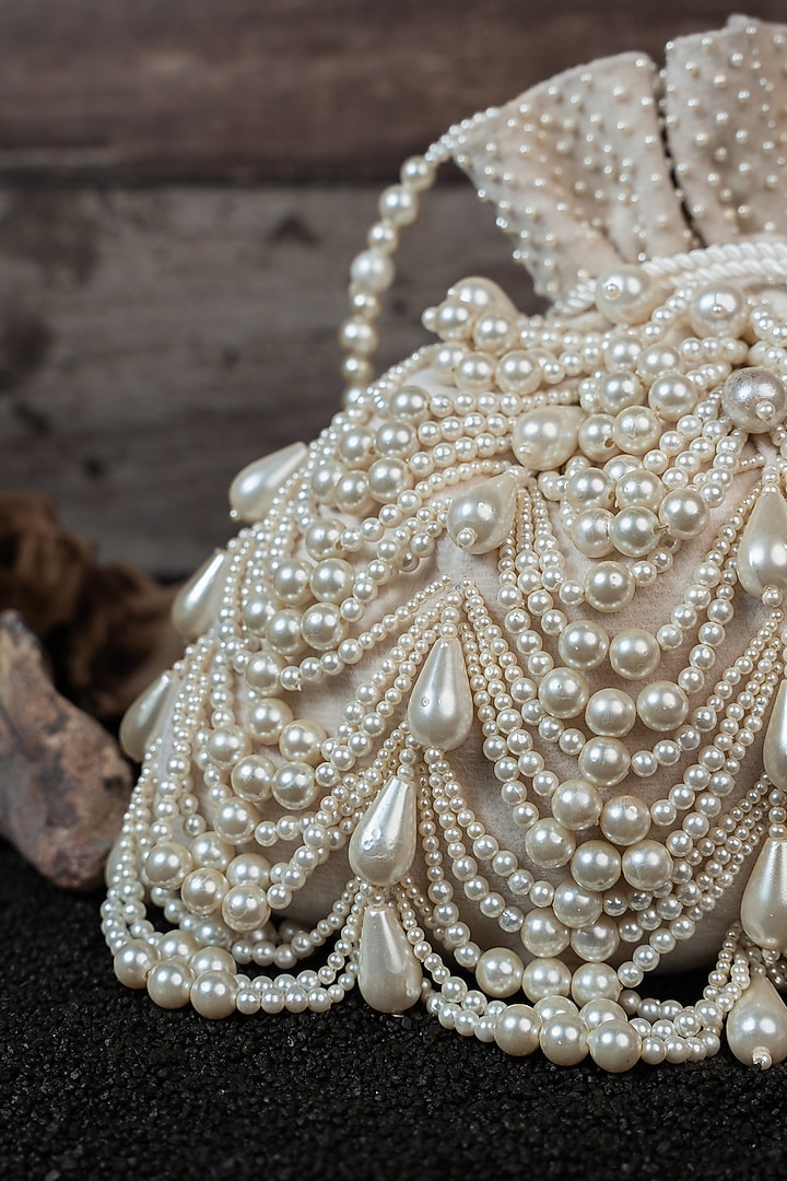Ivory Velvet Embroidered Potli by Nayaab by Sonia at Pernia's Pop Up Shop