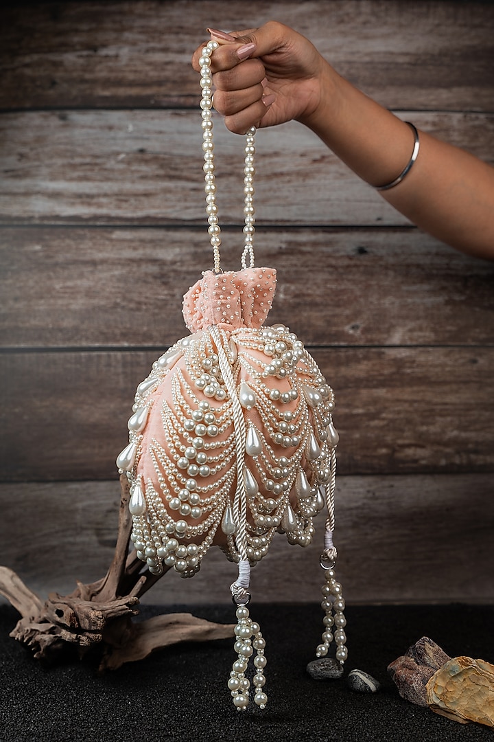 Blush Pink Velvet Pearl Work Potli by Nayaab by Sonia at Pernia's Pop Up Shop