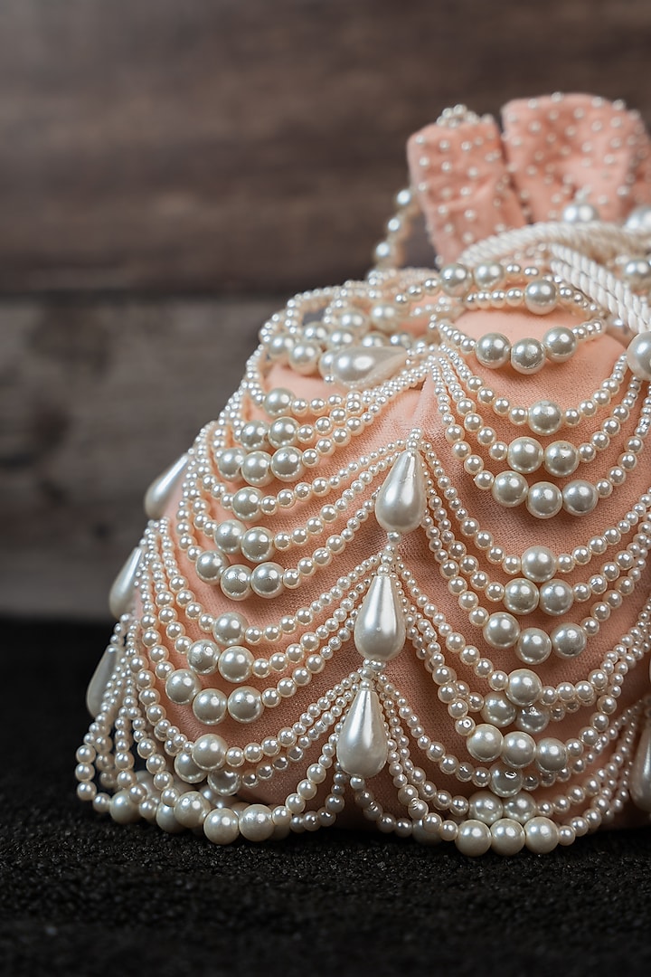Blush Pink Velvet Pearl Work Potli by Nayaab by Sonia at Pernia's Pop Up Shop