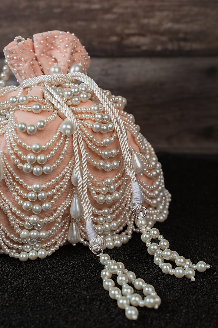 Blush Pink Velvet Pearl Work Potli by Nayaab by Sonia at Pernia's Pop Up Shop