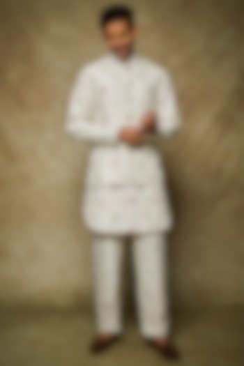 White Dupion Silk Machine Embroidered Bundi Jacket Set by Nero by Shaifali & Satya at Pernia's Pop Up Shop