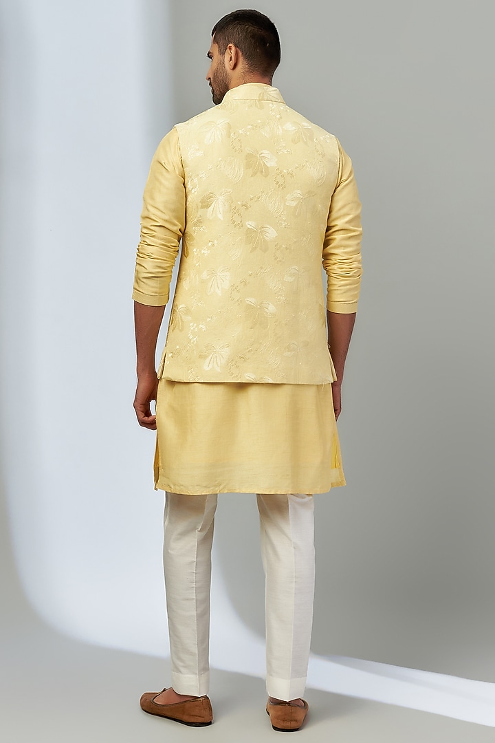 Yellow Dupion Silk Embroidered Bundi Jacket Set by Nero by Shaifali & Satya at Pernia's Pop Up Shop