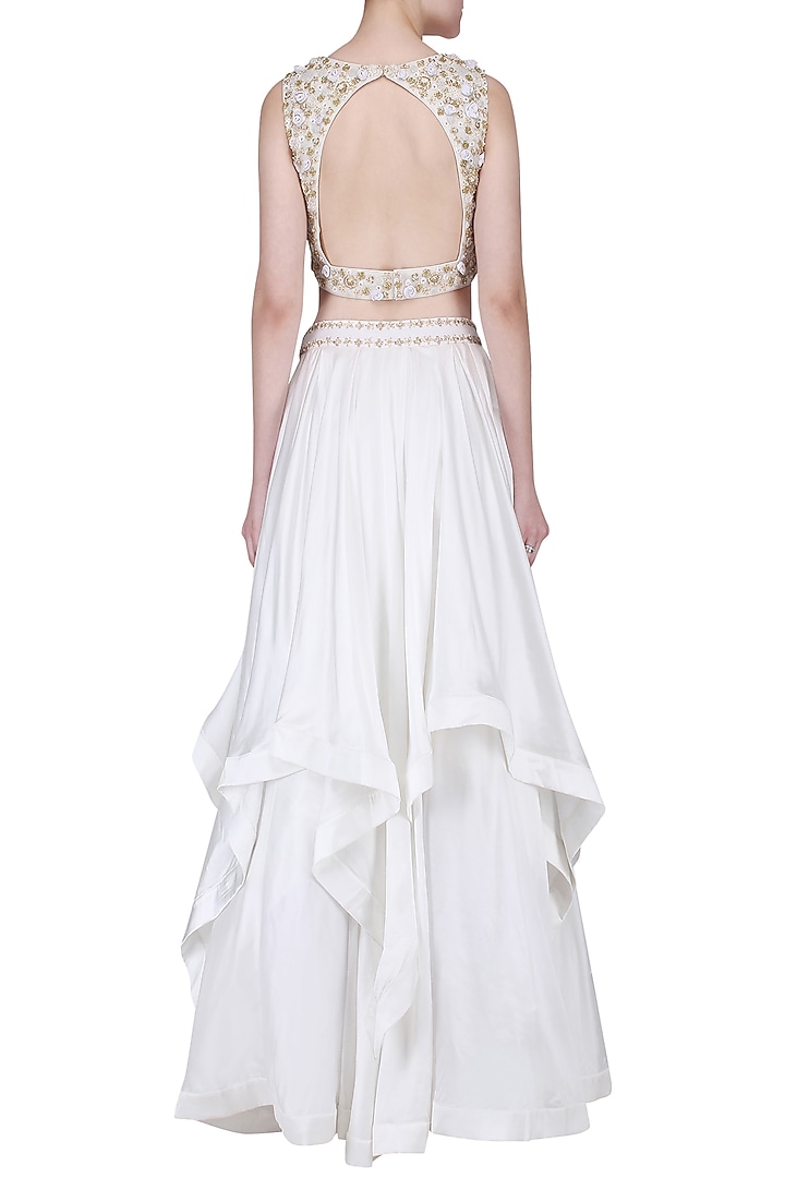 White and gold embroided layered lehenga set available only at Pernia's Pop Up Shop.