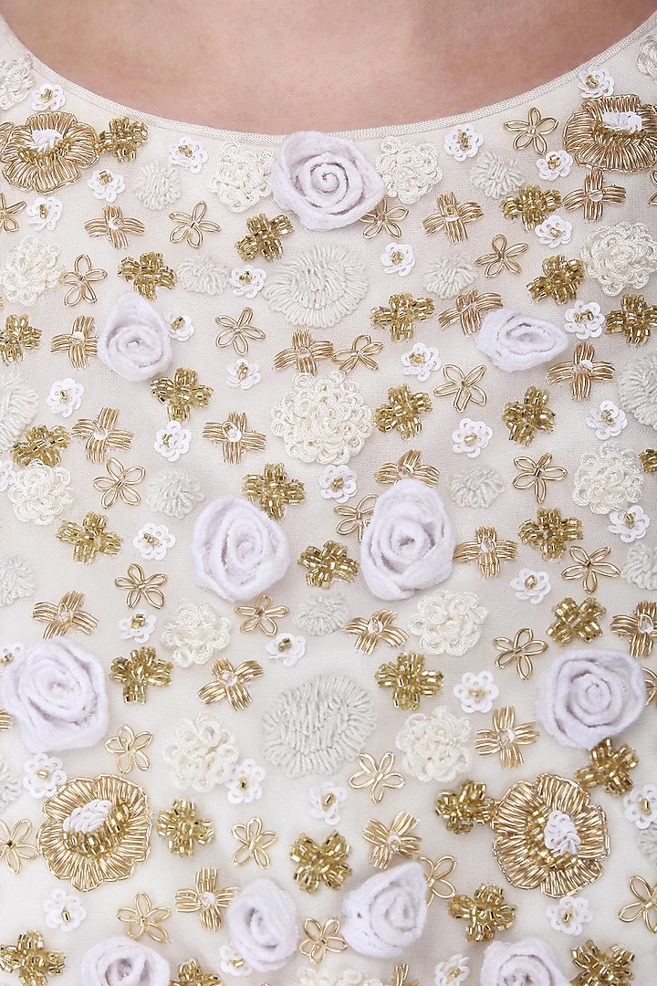 White and gold embroided layered lehenga set available only at Pernia's Pop Up Shop.