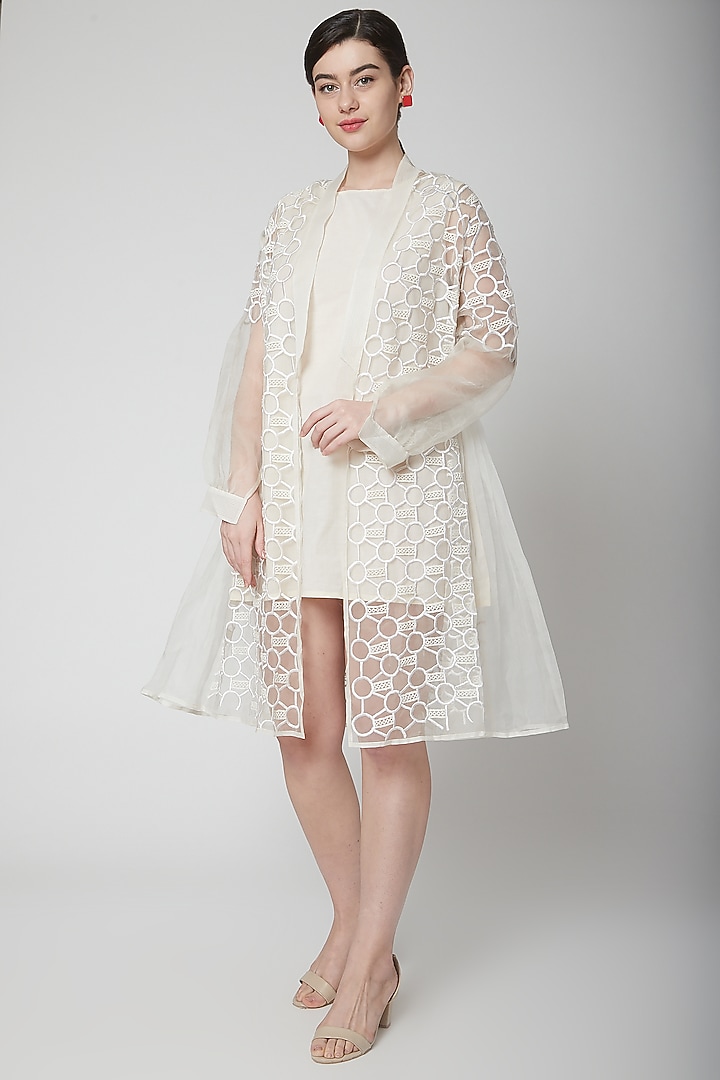 White Thread Embroidered Cape Jacket by Nidhika Shekhar at Pernia's Pop Up Shop
