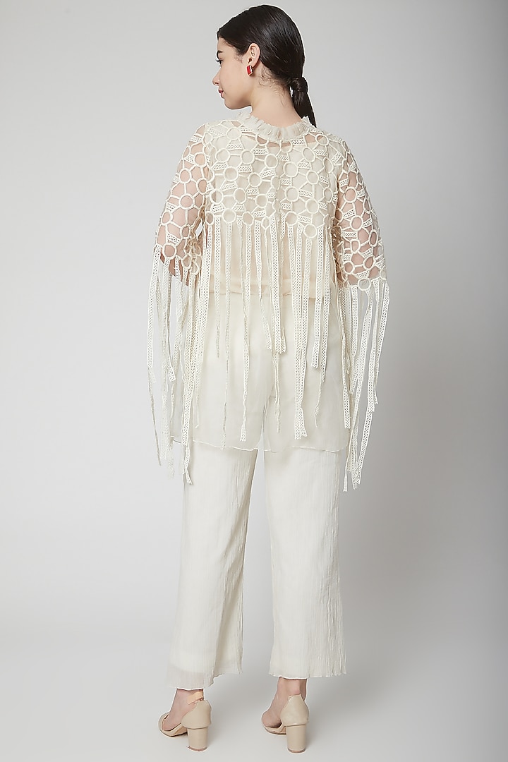 White Embroidered Cape With Fringes by Nidhika Shekhar at Pernia's Pop Up Shop