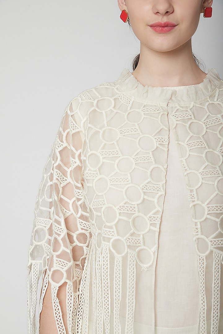 White Embroidered Cape With Fringes by Nidhika Shekhar at Pernia's Pop Up Shop