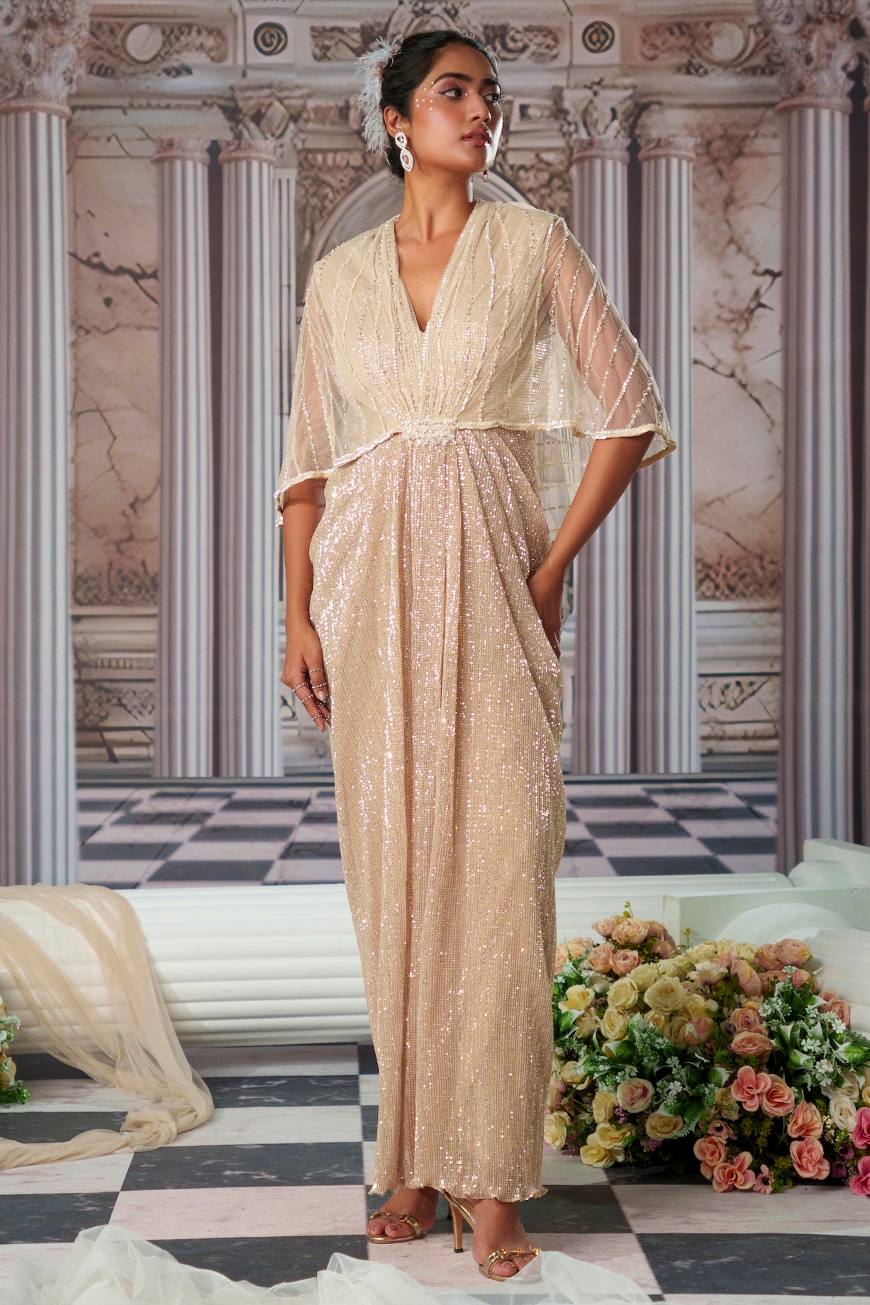 Champagne Shimmer Fabric & Net Embroidered Draped Gown by Nidhika Shekhar  at Pernia's Pop Up Shop 2026