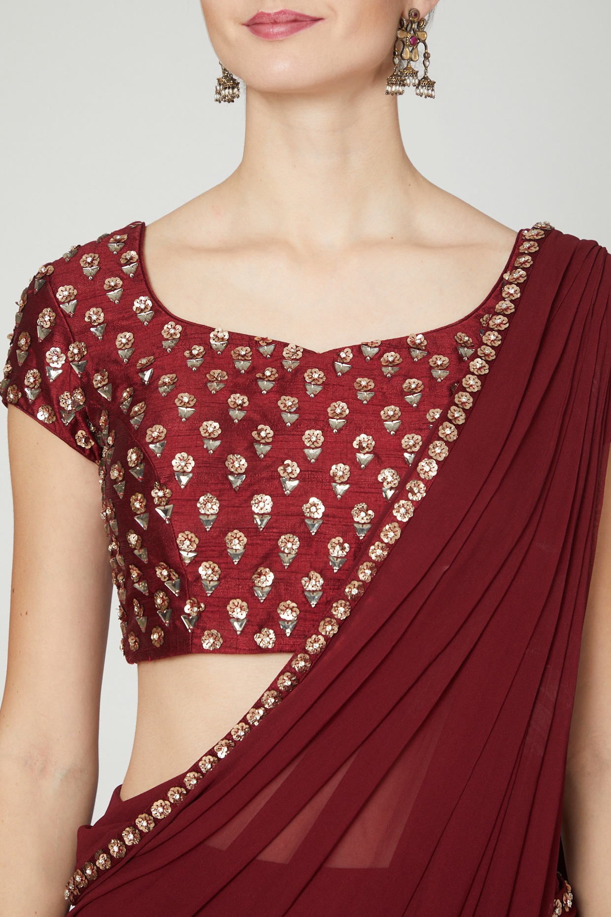 Panashindia.com - Redefine elegance in the timeless couture look of this  beige art silk saree, with a gorgeously beautified maroon blouse. Ideal for  an Indian wedding reception, the saree will set you