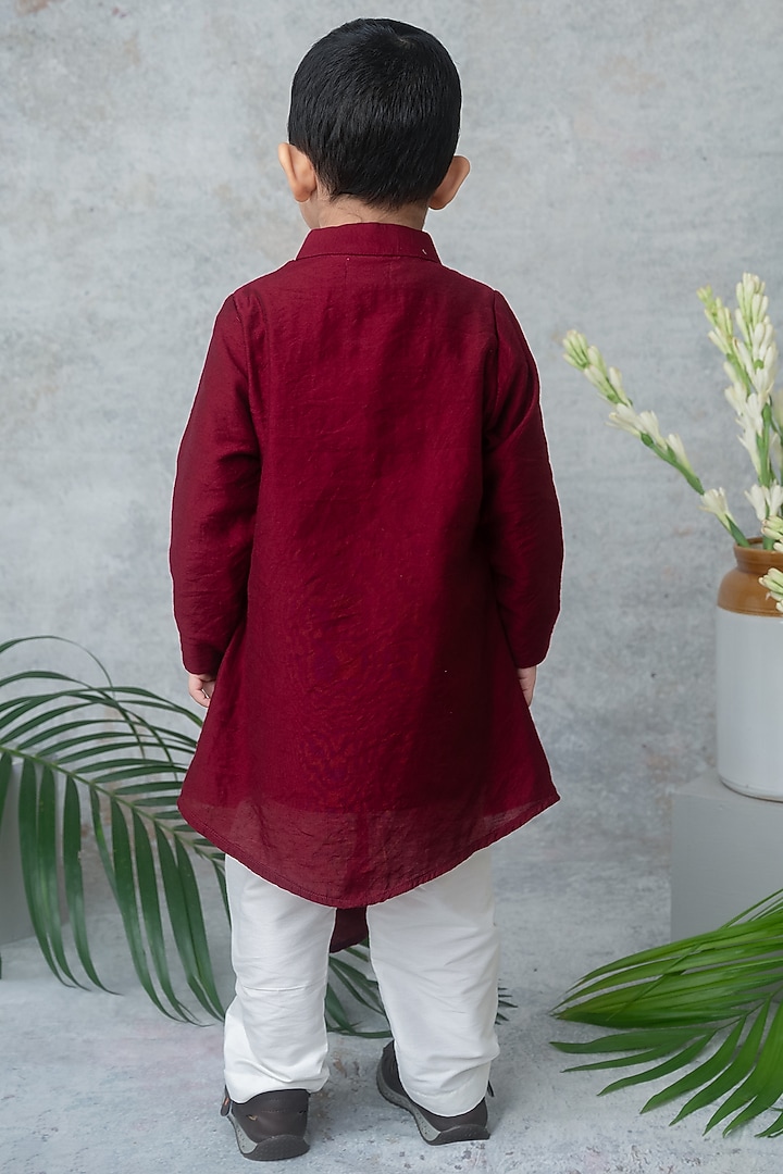 Maroon Dola Silk Hand Block Printed Asymmetric Kurta Set For Boys by Label Neeti at Pernia's Pop Up Shop