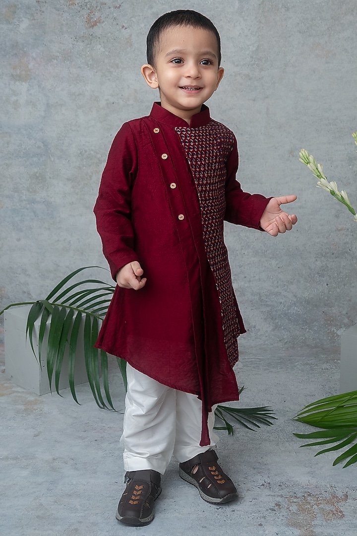 Maroon Dola Silk Hand Block Printed Asymmetric Kurta Set For Boys by Label Neeti at Pernia's Pop Up Shop