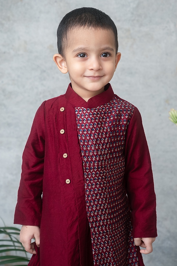 Maroon Dola Silk Hand Block Printed Asymmetric Kurta Set For Boys by Label Neeti at Pernia's Pop Up Shop