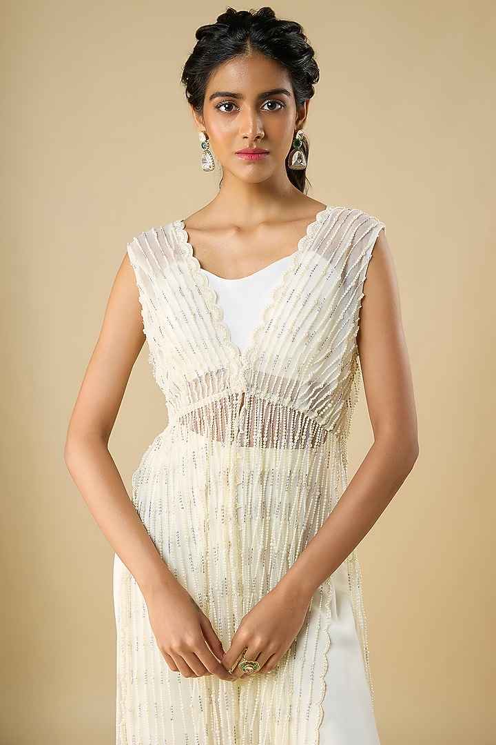 Ivory Net & Viscose Georgette Pearl Embroidered Cape Set by COUTURE BY NIHARIKA at Pernia's Pop Up Shop