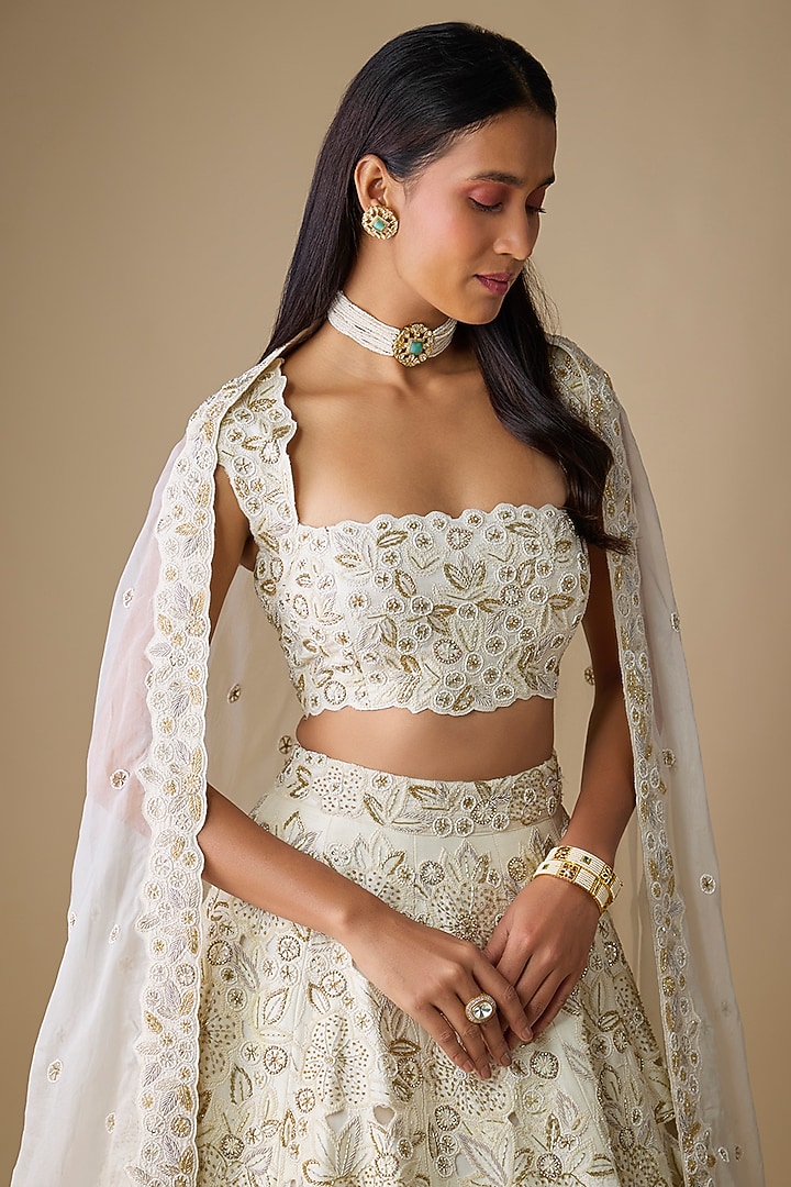 Ivory Silk Embroidered Bridal Lehenga Set by COUTURE BY NIHARIKA at Pernia's Pop Up Shop