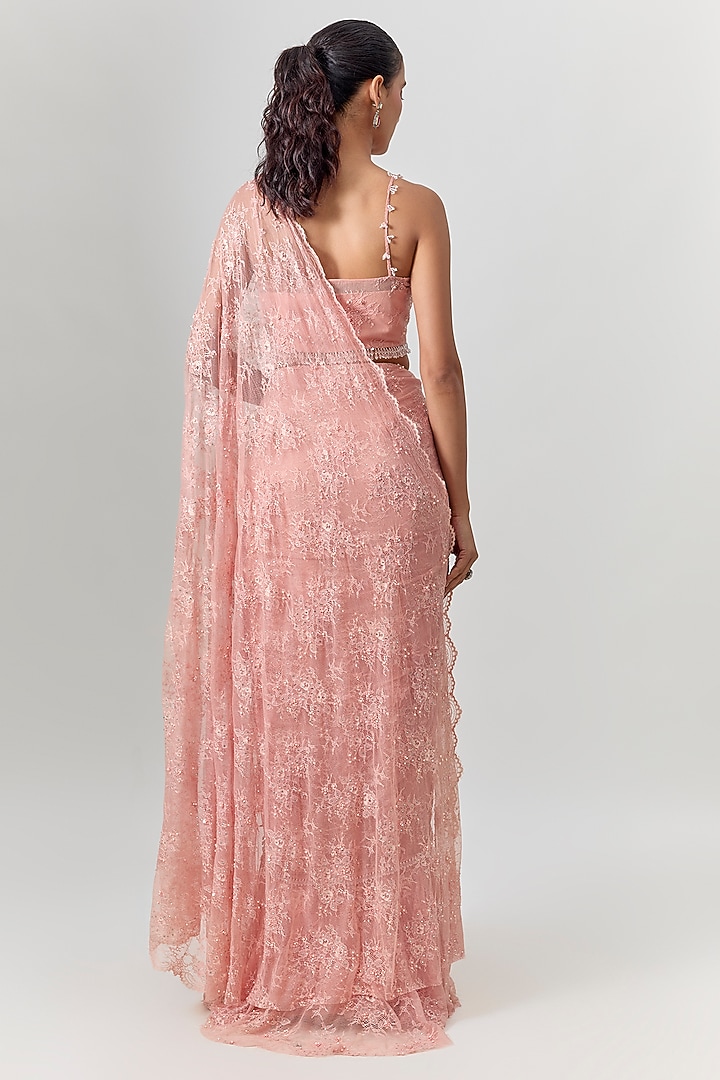 Powder Pink Net Embroidered Draped Reception Saree Set by COUTURE BY NIHARIKA at Pernia's Pop Up Shop