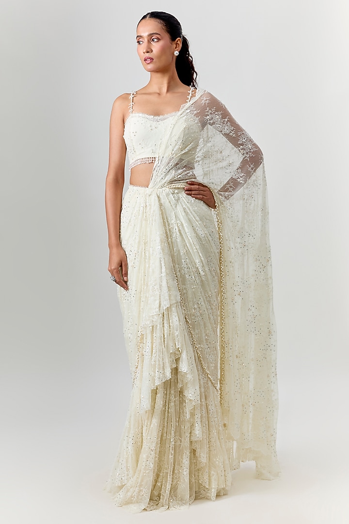 Ivory Net Embroidered Draped Reception Saree Set by COUTURE BY NIHARIKA at Pernia's Pop Up Shop