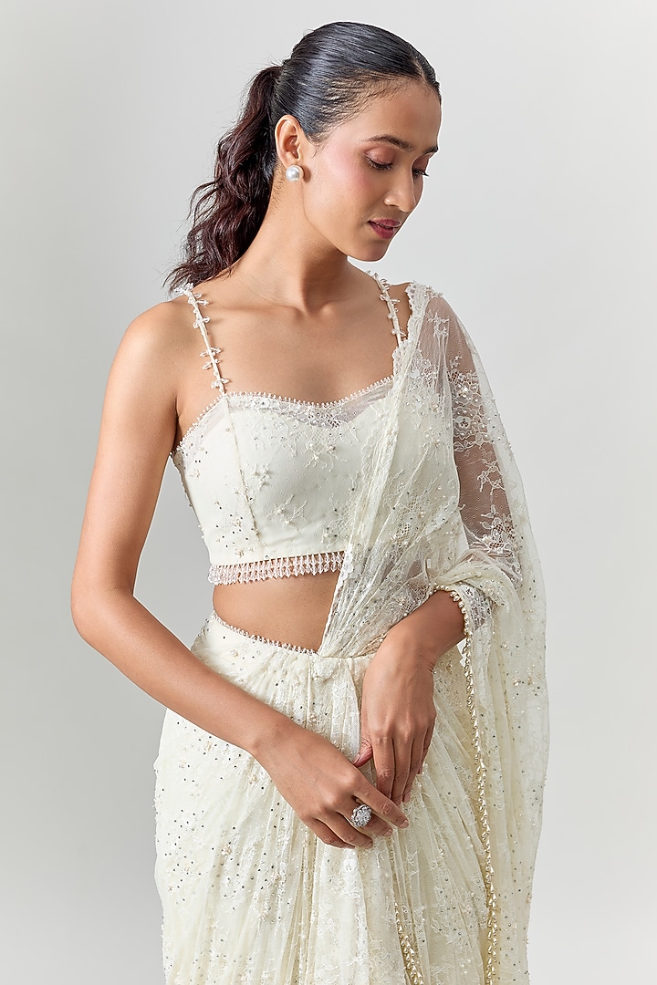 Ivory Net Embroidered Draped Reception Saree Set by COUTURE BY NIHARIKA at Pernia's Pop Up Shop