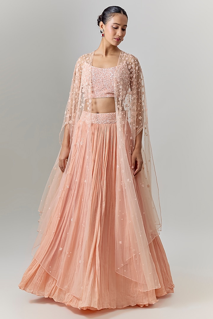Peach Net & Viscose Motif Embroidered Wedding Lehenga Set by COUTURE BY NIHARIKA at Pernia's Pop Up Shop
