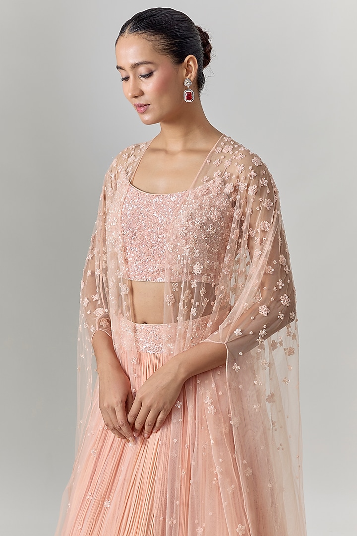 Peach Net & Viscose Motif Embroidered Wedding Lehenga Set by COUTURE BY NIHARIKA at Pernia's Pop Up Shop